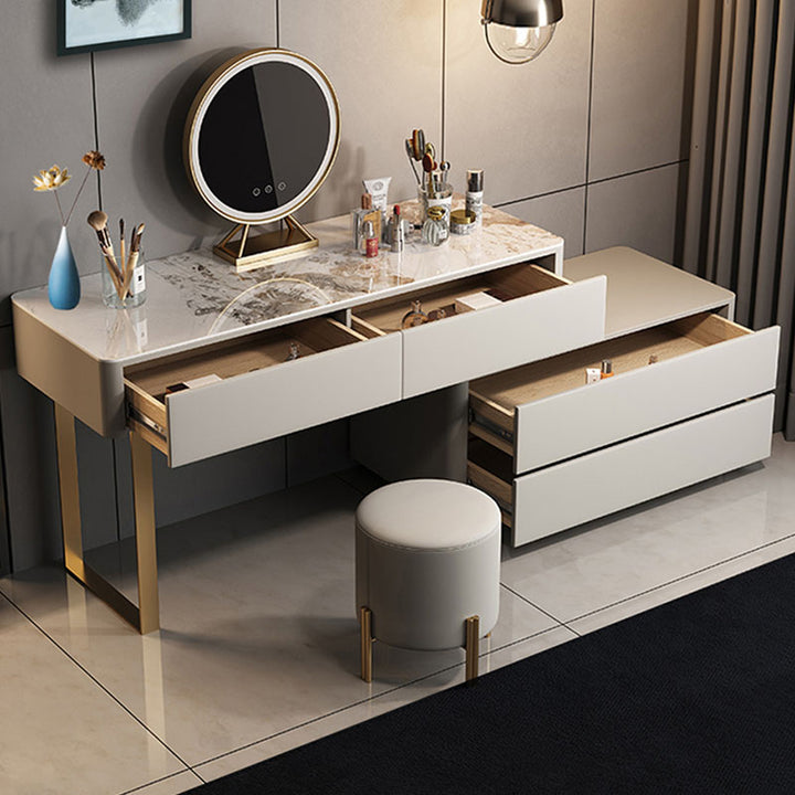 Cozy dressing table setup with white furniture and decor